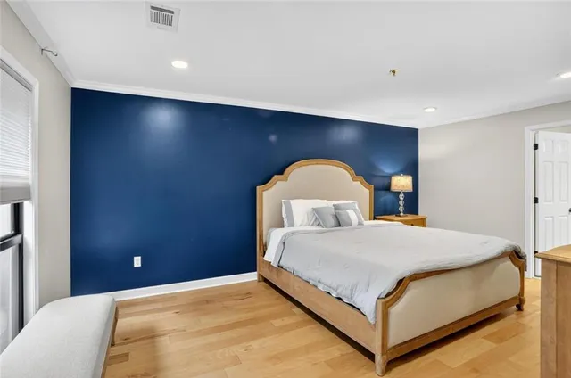 a bedroom with a bed and a dresser