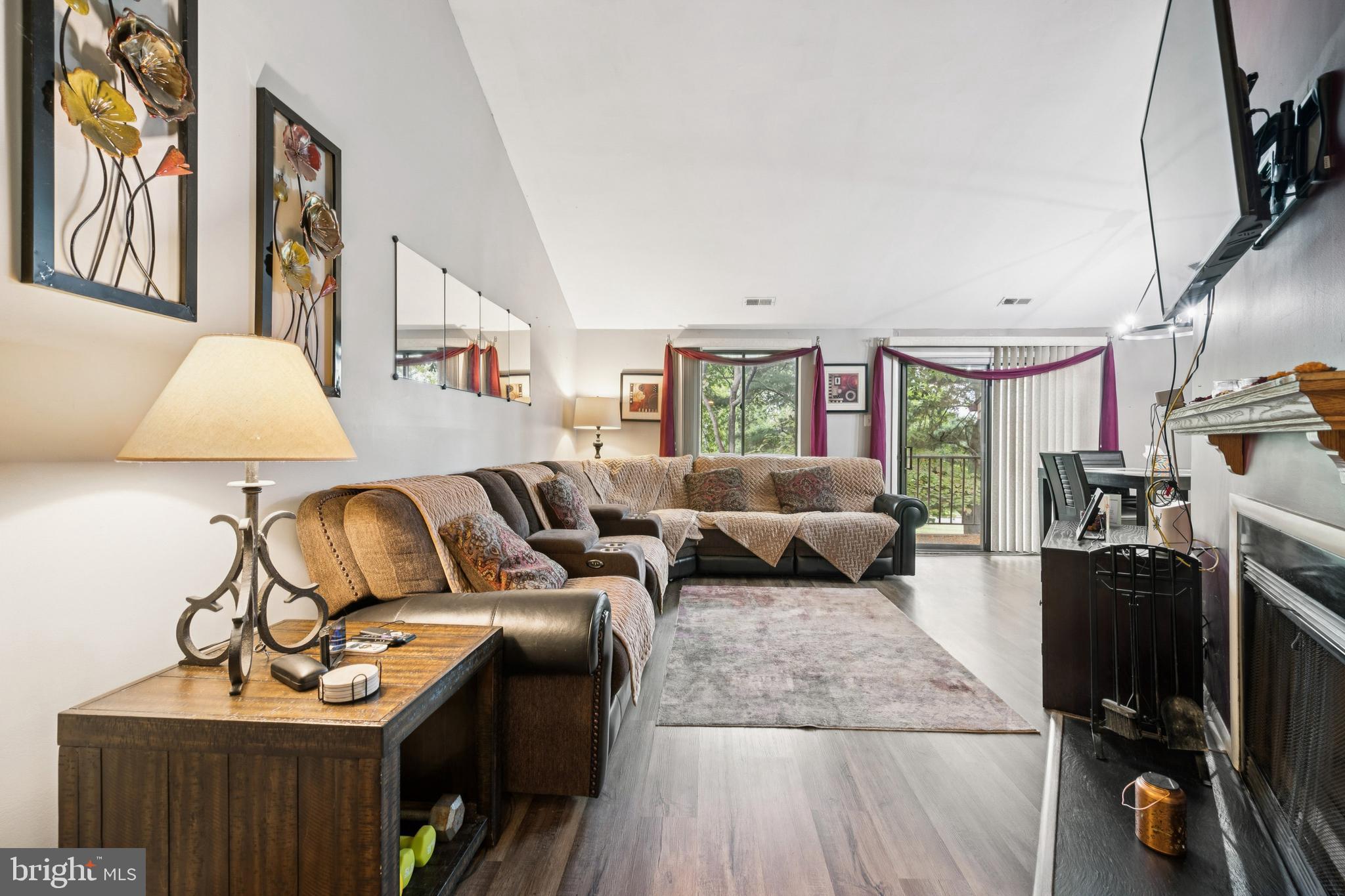 105 B Cypress Point Circle Mount Laurel, NJ 08054 - Photo 11 of 24 a living room with furniture a flat screen tv and a couch