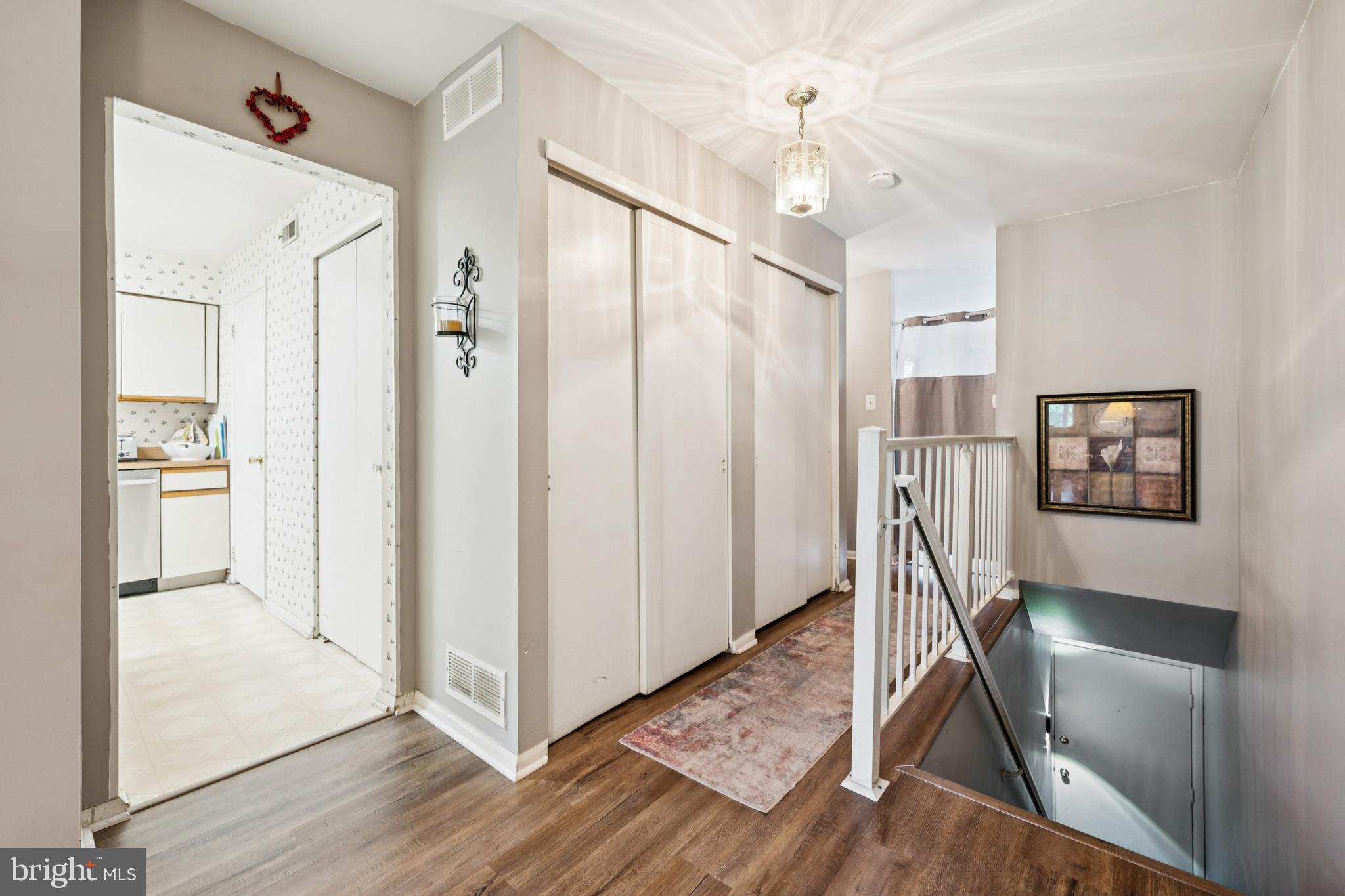 105 B Cypress Point Circle Mount Laurel, NJ 08054 - Photo 19 of 24 a view of a hallway with wooden floor and workspace