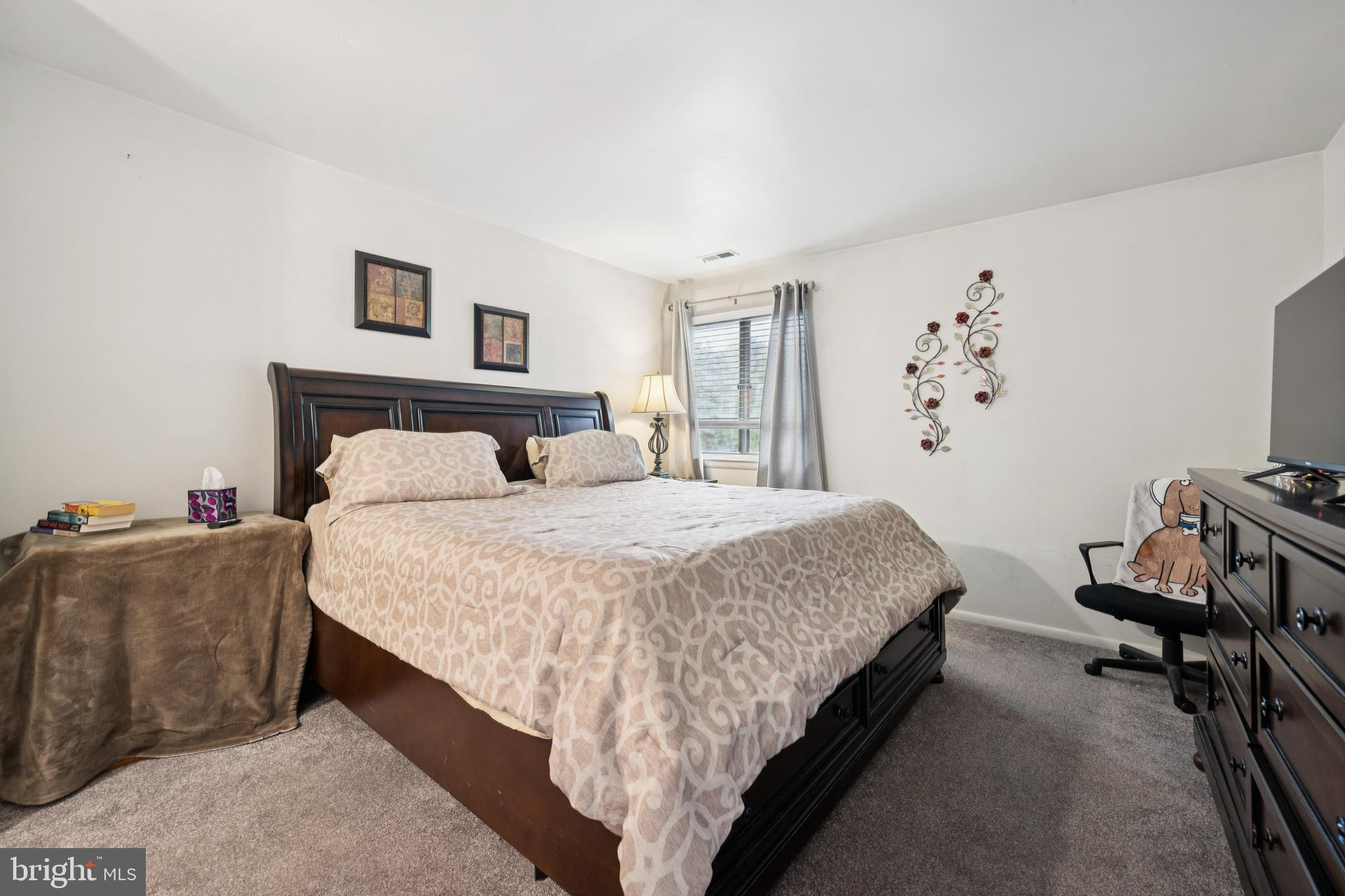 105 B Cypress Point Circle Mount Laurel, NJ 08054 - Photo 20 of 24 a bedroom with a bed and a couch