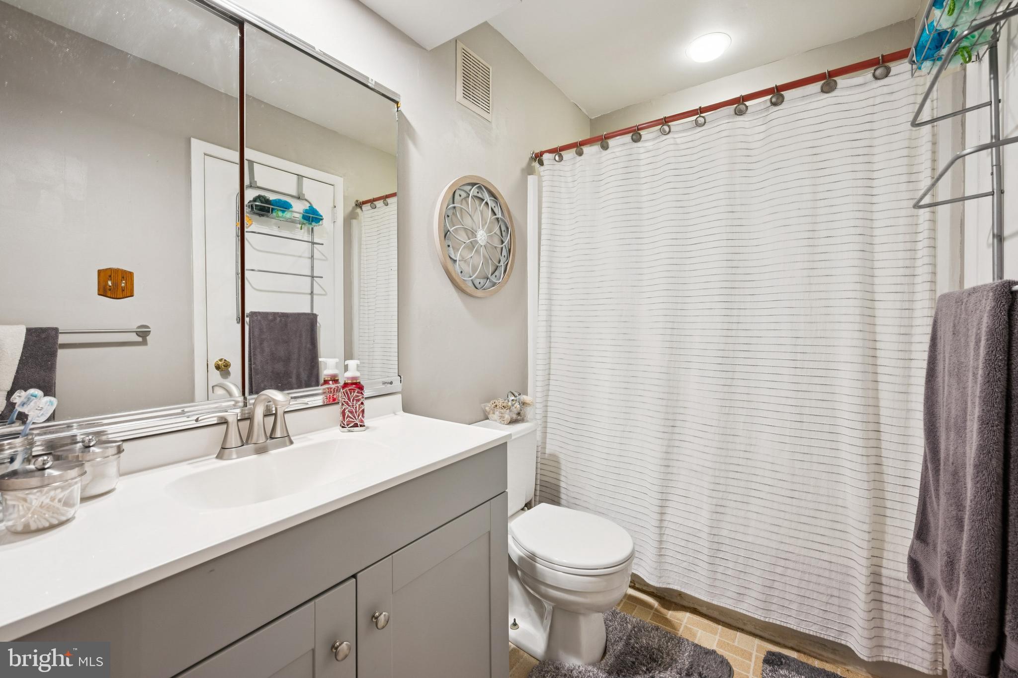 105 B Cypress Point Circle Mount Laurel, NJ 08054 - Photo 21 of 24 a bathroom with a sink a toilet and a mirror