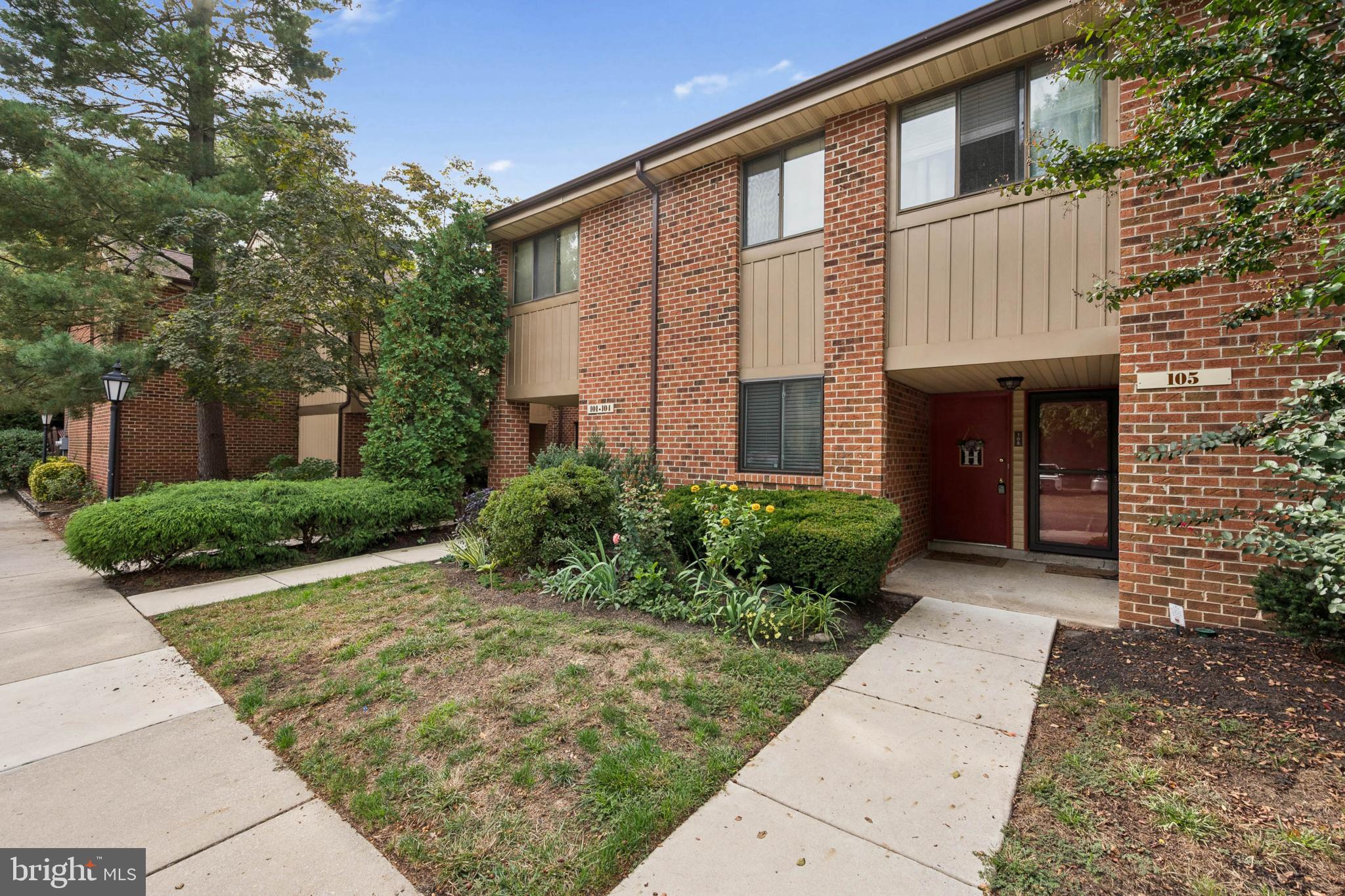 105 B Cypress Point Circle Mount Laurel, NJ 08054 - Photo 5 of 24 a front view of a house with garden