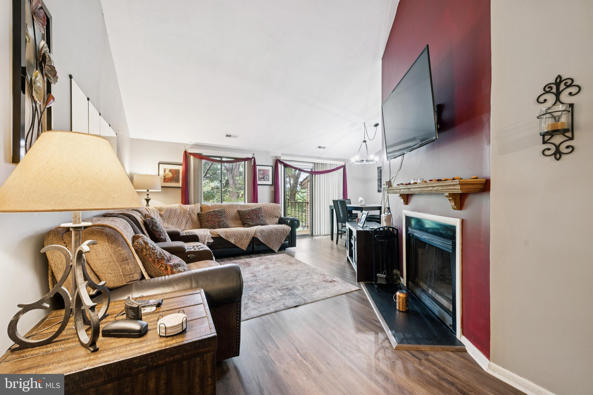 105 B Cypress Point Circle Mount Laurel, NJ 08054 - Photo 7 of 24 a living room with furniture a flat screen tv and a fireplace