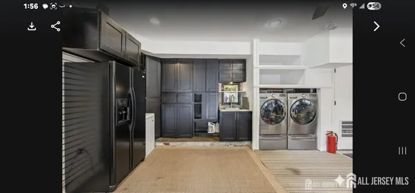 a view of a hallway with washer and dryer
