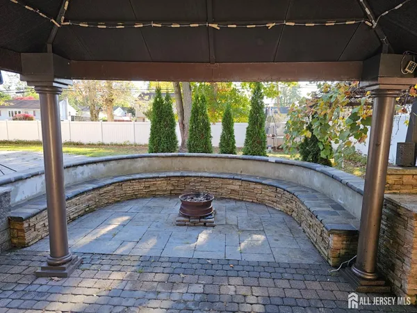 a view of a room with wooden floor and outdoor space