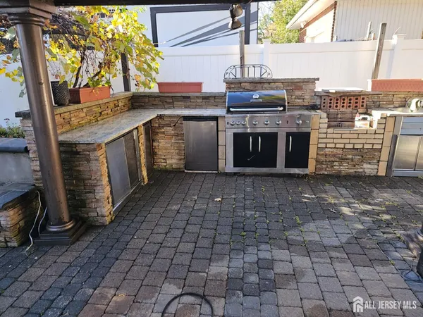 a view of a kitchen with a sink and cabinets