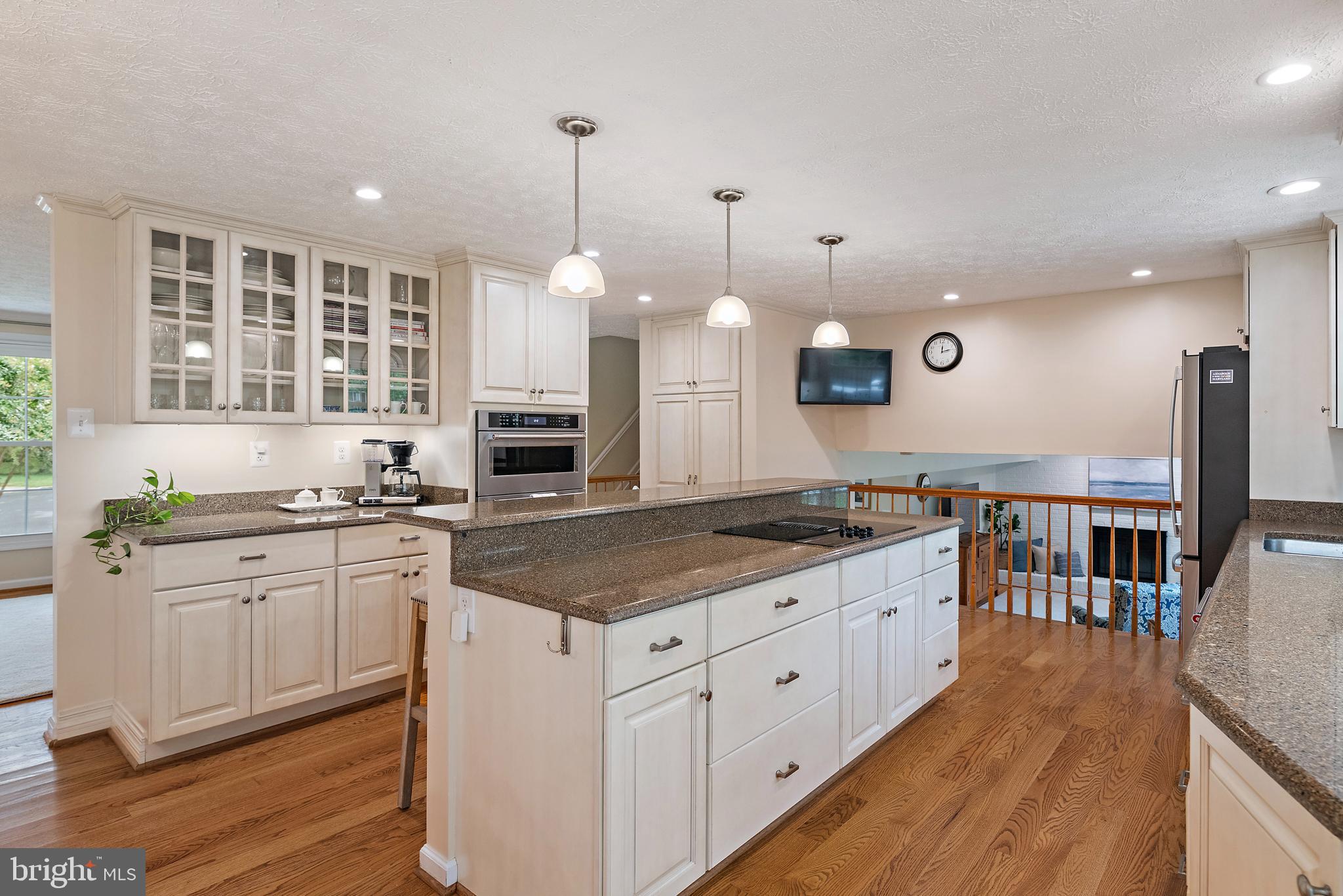 333 Brunswick Place Riva, MD 21140 - Photo 12 of 60 a kitchen with stainless steel appliances granite countertop a stove a sink and a wooden floors