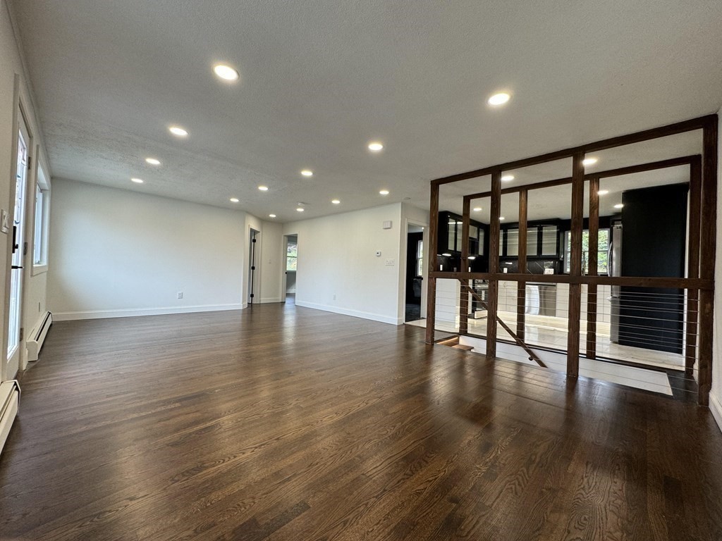 10 Proctor Street Worcester, MA 01606 - Photo 12 of 31 a view of an empty room with wooden floor and glass door