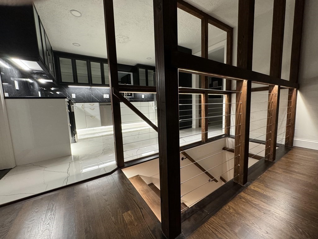 10 Proctor Street Worcester, MA 01606 - Photo 15 of 31 a view of staircase with lots of wooden floor