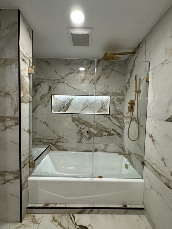 10 Proctor Street Worcester, MA 01606 - Photo 20 of 31 a bathroom with a bathtub and a shower