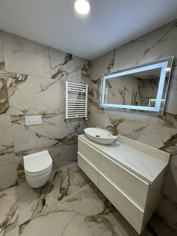 10 Proctor Street Worcester, MA 01606 - Photo 21 of 31 a bathroom with a sink toilet and shower