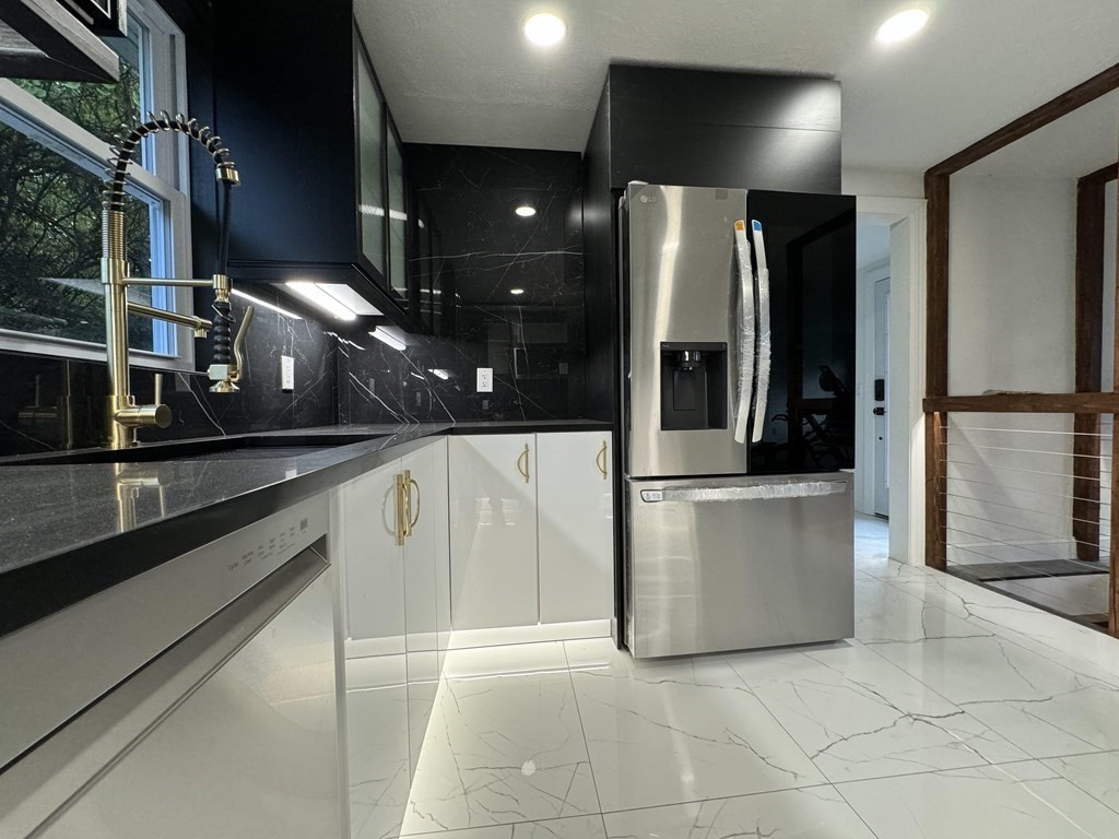 10 Proctor Street Worcester, MA 01606 - Photo 3 of 31 a view of a refrigerator in a kitchen