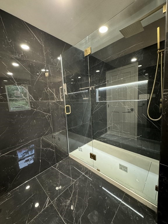 10 Proctor Street Worcester, MA 01606 - Photo 6 of 31 a bathroom with a shower and a bathtub