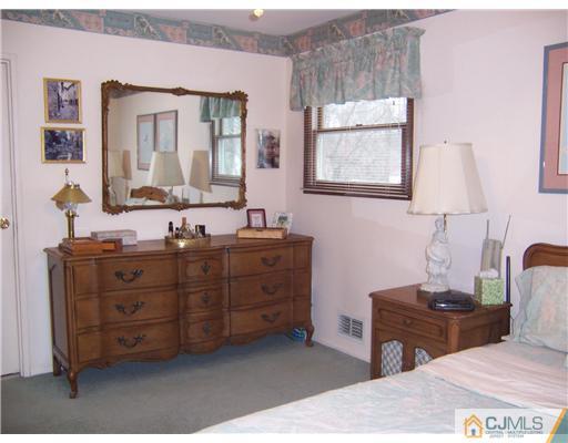 638 New Dover Road Colonia, NJ 07067 - Photo 13 of 23 a bathroom with a sink and a mirror