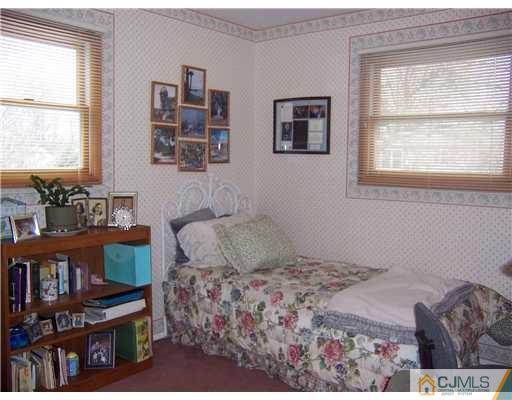 638 New Dover Road Colonia, NJ 07067 - Photo 14 of 23 a bedroom with furniture and a window