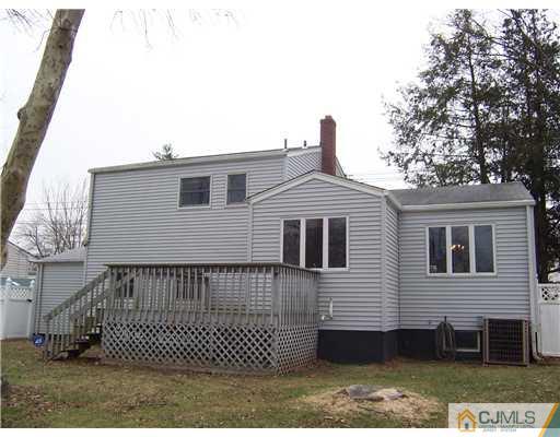 638 New Dover Road Colonia, NJ 07067 - Photo 22 of 23 a view of a house with a yard