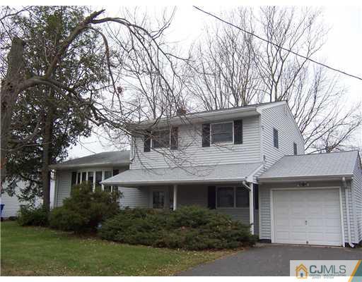 638 New Dover Road Colonia, NJ 07067 - Photo 23 of 23 a front view of a house with garden
