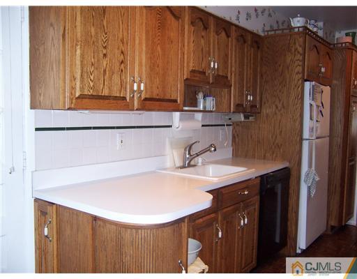 638 New Dover Road Colonia, NJ 07067 - Photo 4 of 23 a bathroom with a sink a mirror and shower