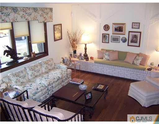 638 New Dover Road Colonia, NJ 07067 - Photo 5 of 23 a living room with furniture and painting on the wall