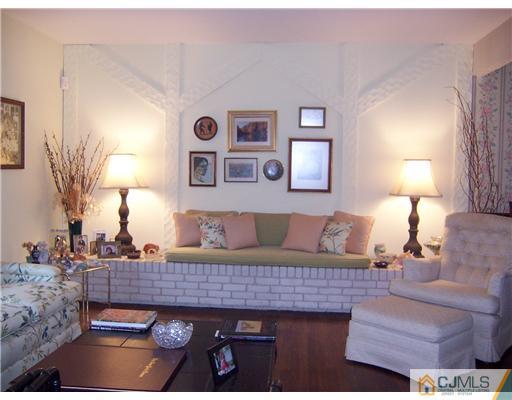 638 New Dover Road Colonia, NJ 07067 - Photo 6 of 23 a living room with furniture and a lamp