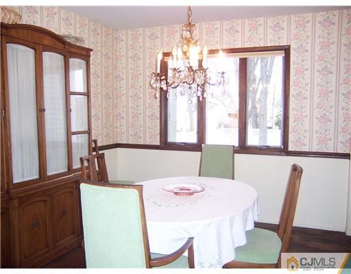638 New Dover Road Colonia, NJ 07067 - Photo 8 of 23 a view of a dining room with furniture and window