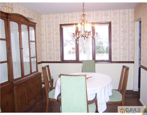 638 New Dover Road Colonia, NJ 07067 - Photo 9 of 23 a view of a dining room with furniture window and wooden floor