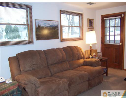 638 New Dover Road Colonia, NJ 07067 - Photo 10 of 23 a living room with furniture and a window