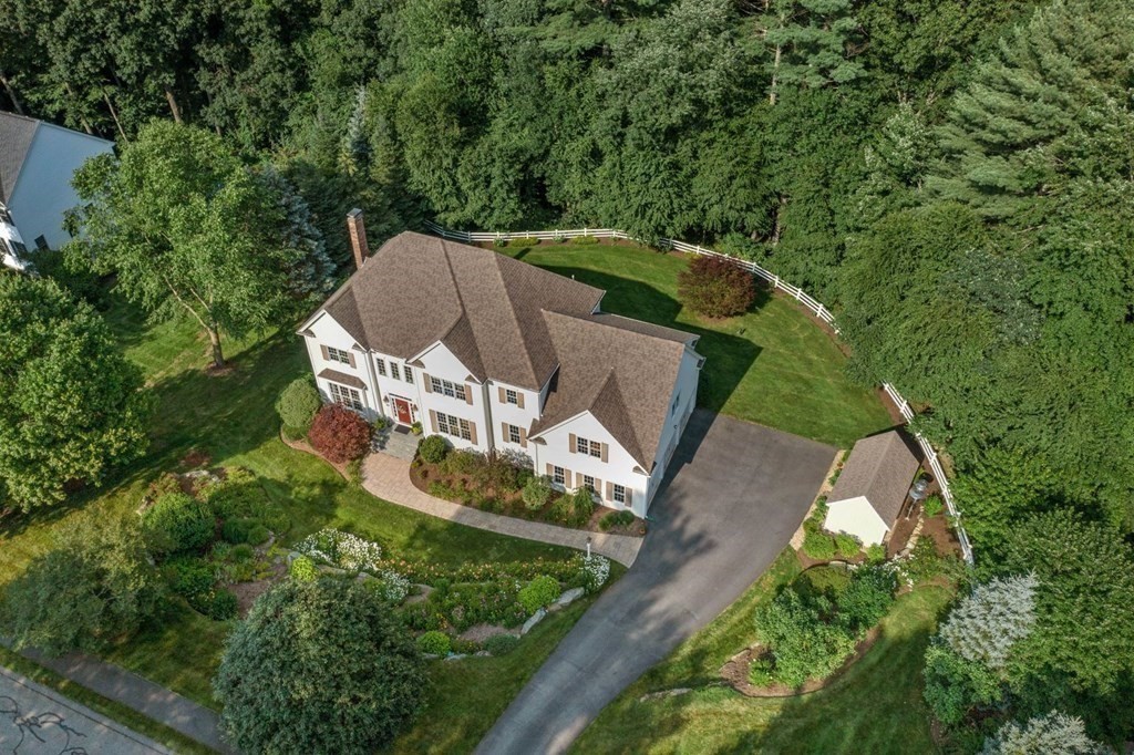 22 Falcon Ridge Drive Hopkinton, MA 01748 - Photo 1 of 42 an aerial view of a house with a yard and large trees