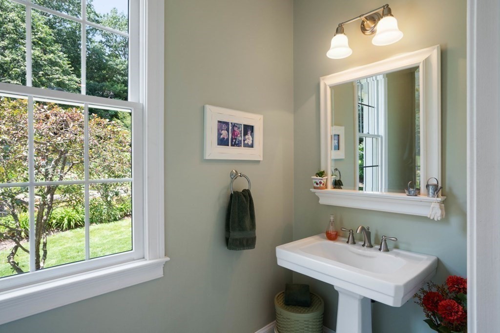 22 Falcon Ridge Drive Hopkinton, MA 01748 - Photo 17 of 42 a bathroom with a sink and a mirror