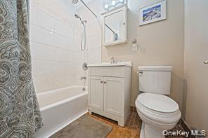 200 Atlantic Avenue, Unit 331 Lynbrook, NY 11563 - Photo 28 of 28 a bathroom with a sink a toilet and a bathtub
