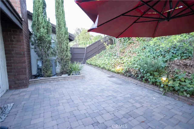 a view of a backyard with potted plants