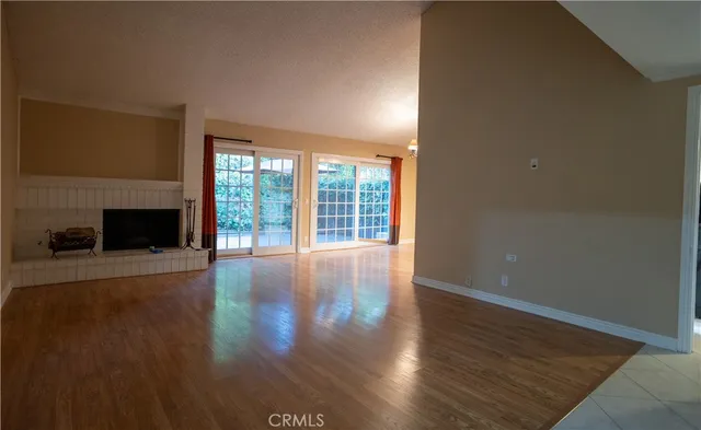 a view of a livingroom with furniture window and wooden floor