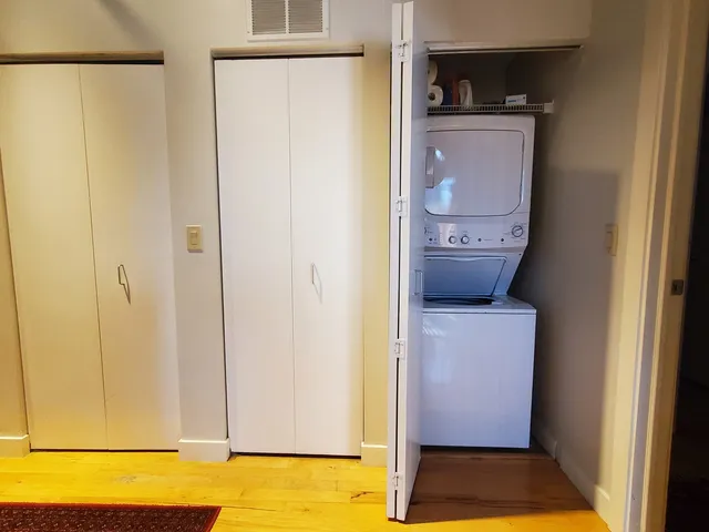 a room that has a bed and a table in it