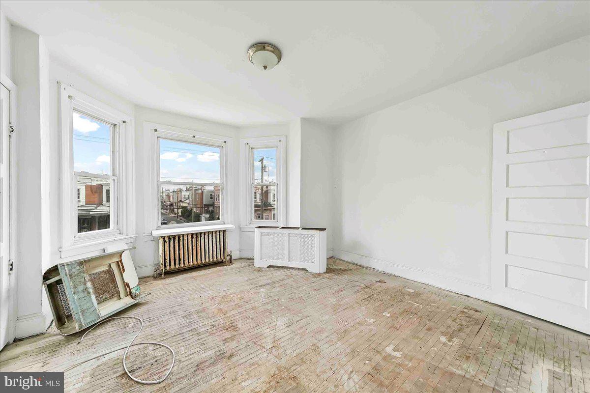 5536 Pine Street Philadelphia, PA 19143 - Photo 15 of 32 a view of an empty room with a window