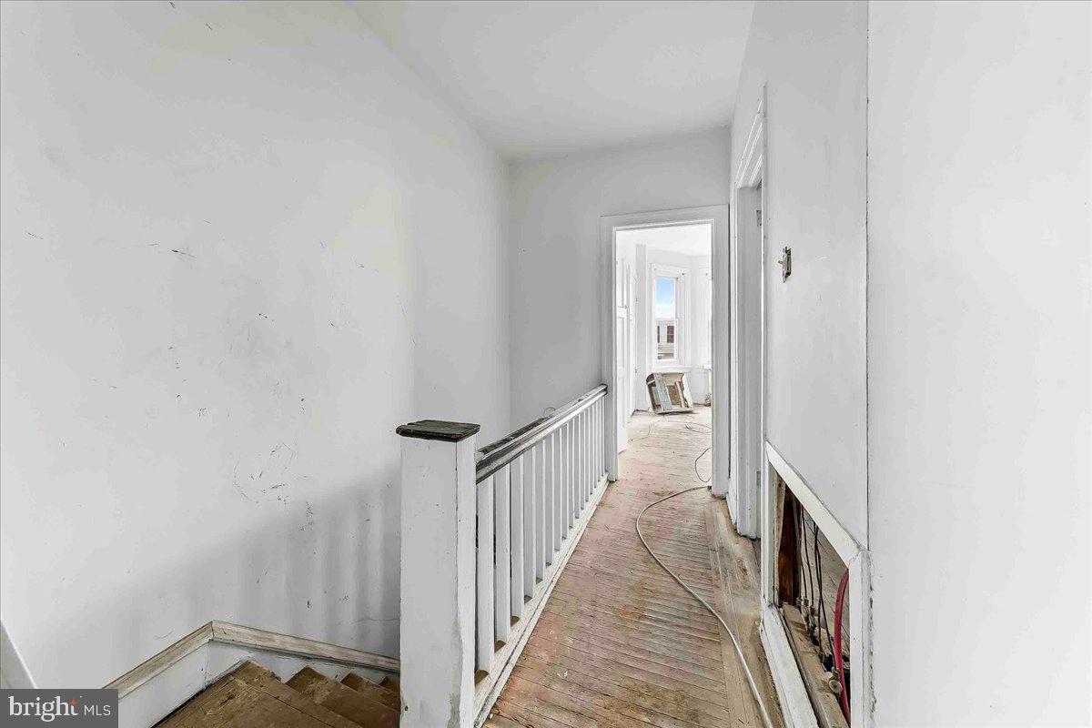 5536 Pine Street Philadelphia, PA 19143 - Photo 26 of 32 a view of a hallway with wooden floor
