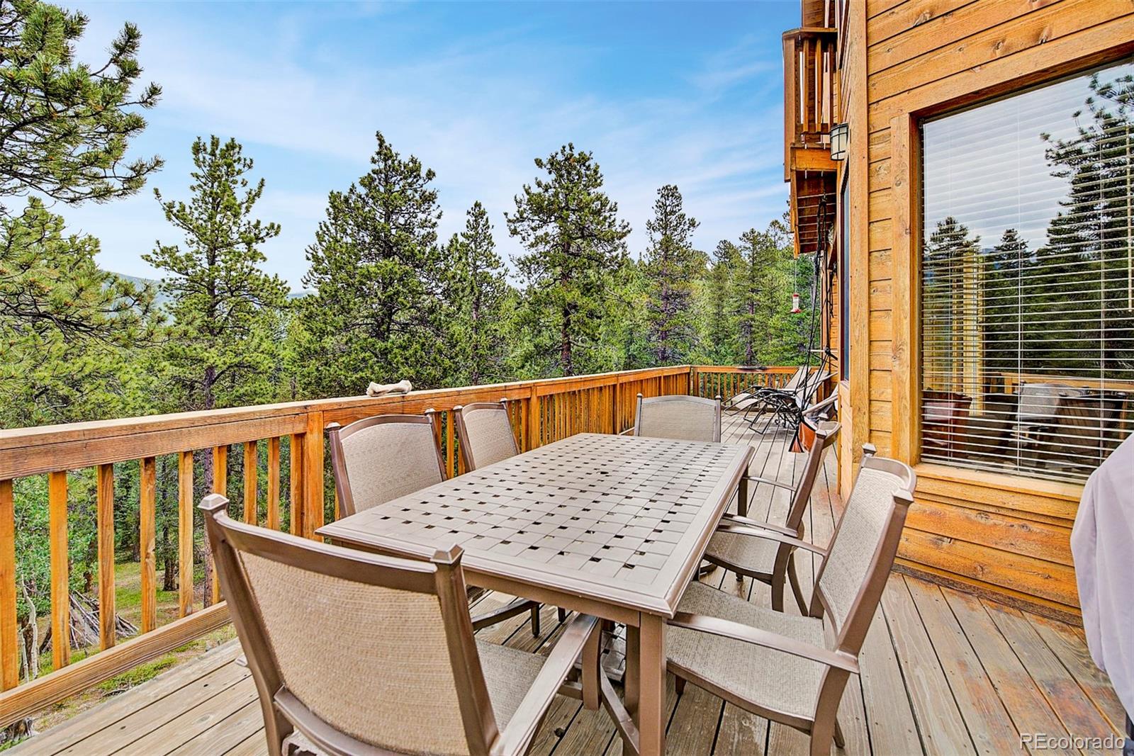 746 Clark Road Bailey, CO 80421 - Photo 8 of 28 a view of a chairs on the roof deck