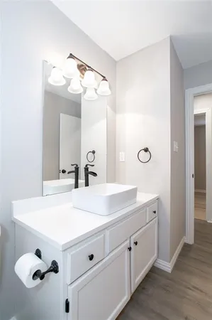 a bathroom with a double vanity sink mirror and
