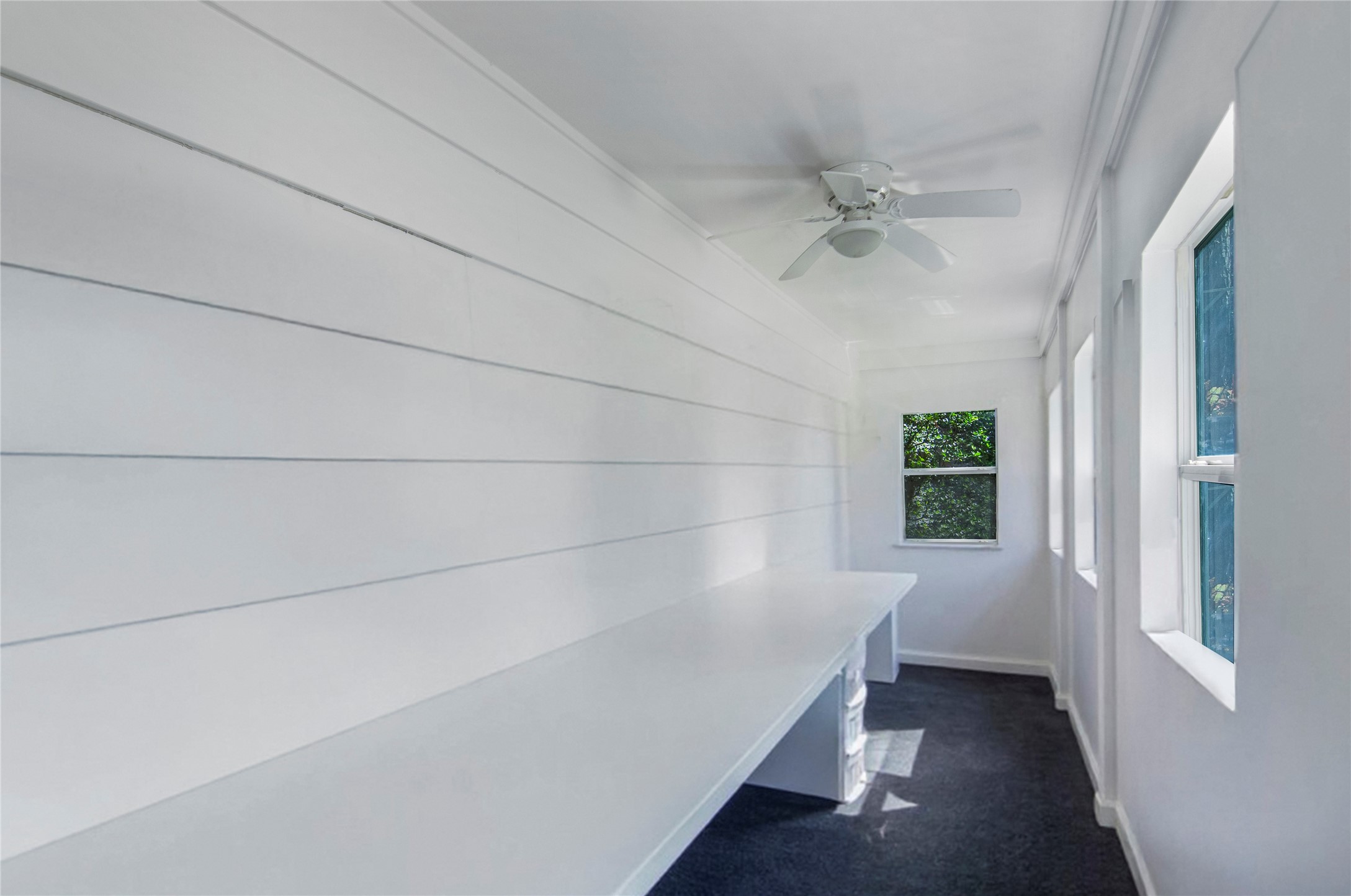 532 Raleigh Drive Conroe, TX 77302 - Photo 27 of 40 Light-filled enclosed sitting area with bench seating overlooking the backyard. Offers a peaceful extension of the living space.