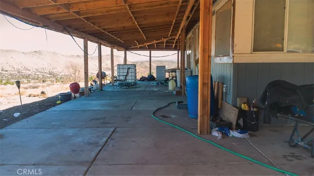 a view of a porch with wooden floor