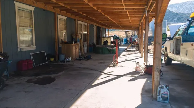 a view of a backyard of a house with a water view