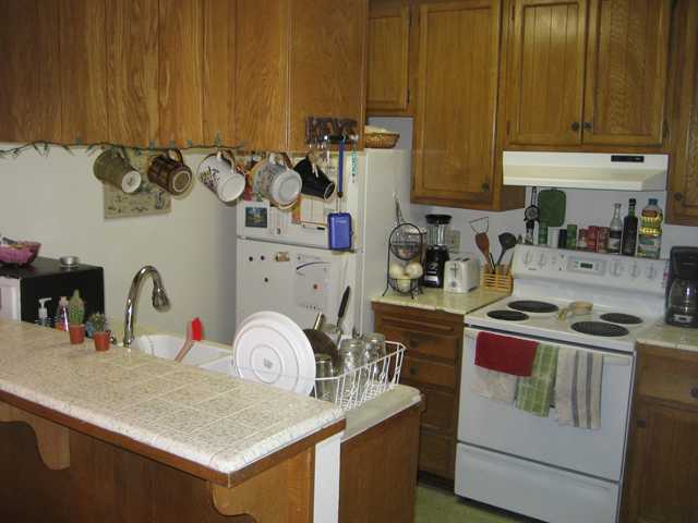 Kitchen includes a pantry closet-lot's of storage, fridge & stove convey.