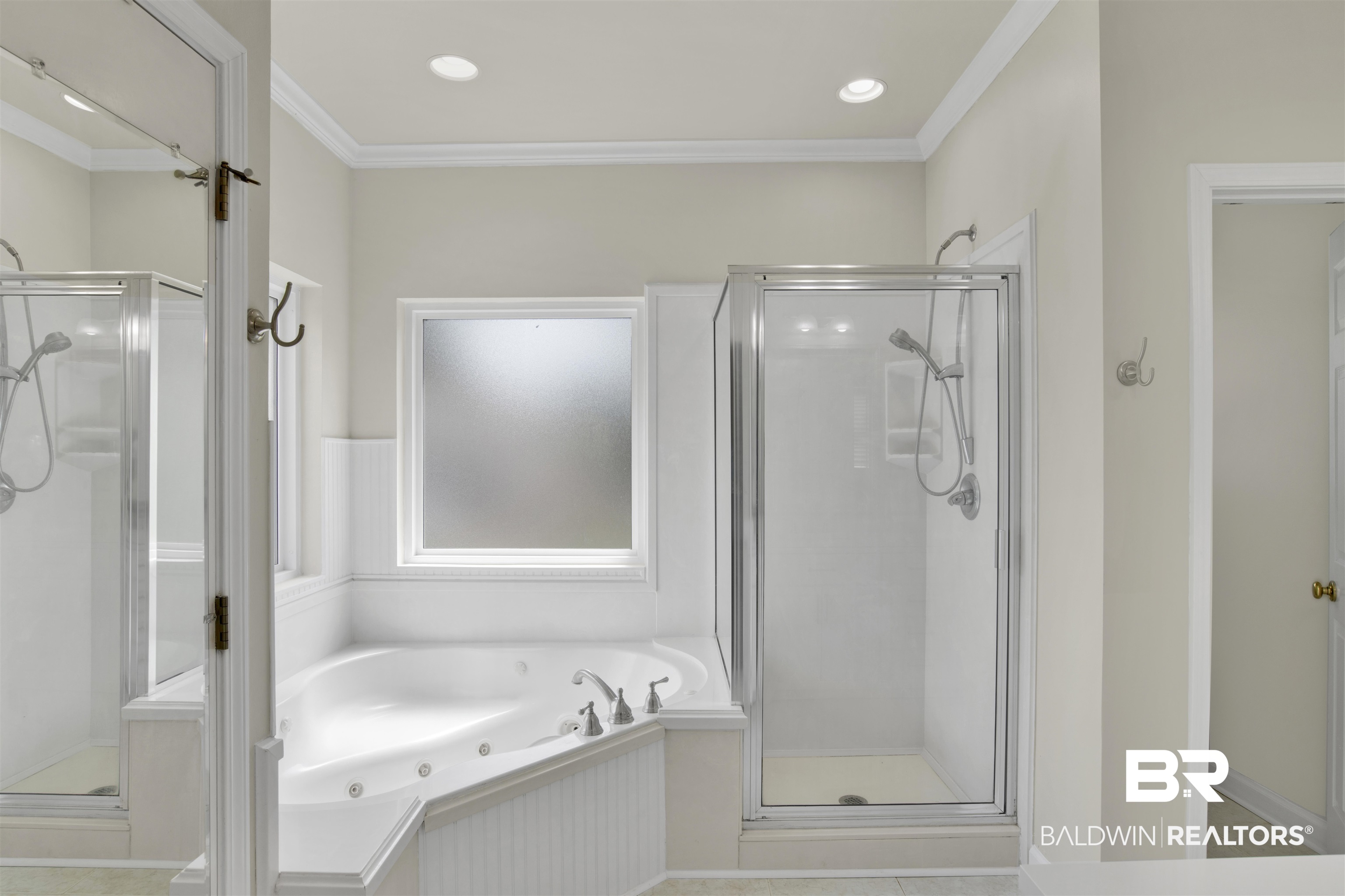 638 Southern Way Daphne, AL 36527 - Photo 15 of 26 Bathroom with separate shower and tub, tile patterned floors, and ornamental molding