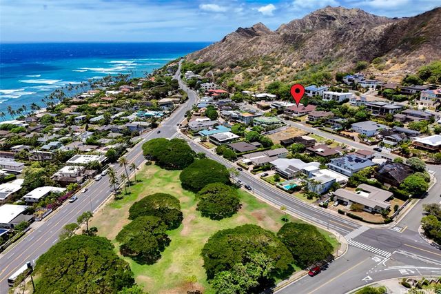 an aerial view of residential houses with outdoor space