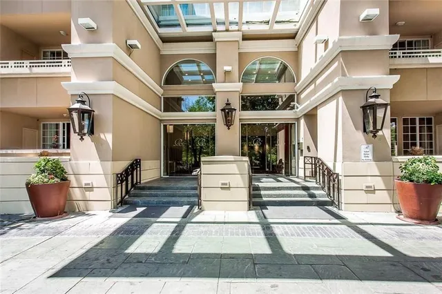 a view of a white building with many windows