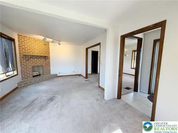 a view of an empty room with glass door