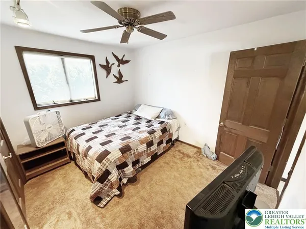 a bedroom with a bed and cabinets