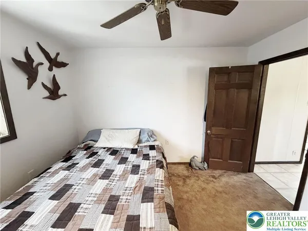 a bathroom with a window and a shower