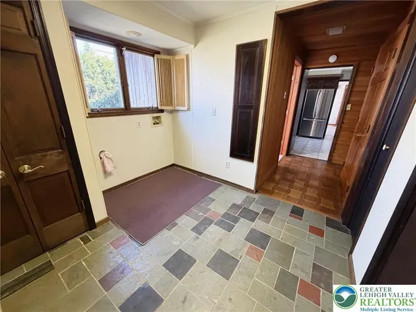 a view of a living room and front door