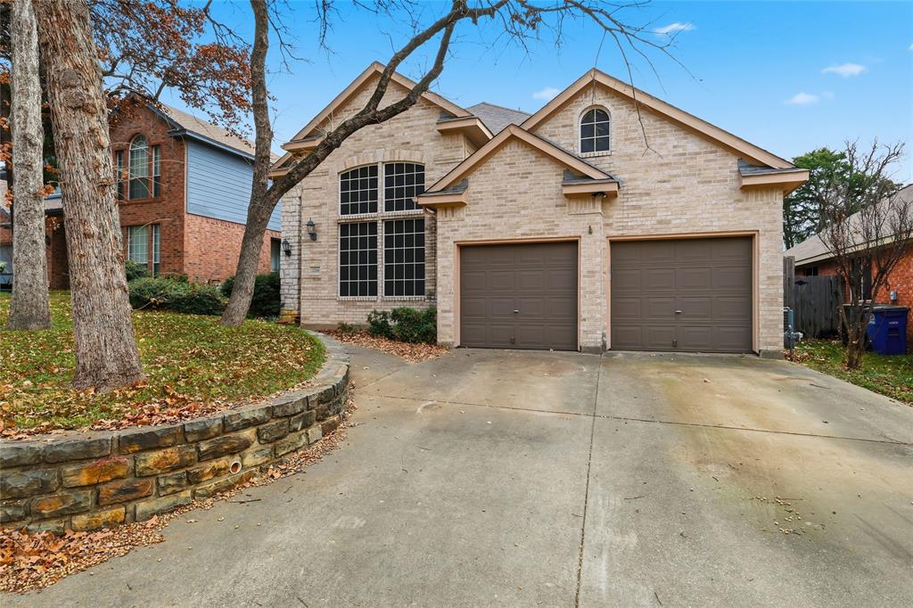 2216 Post Oak Court Corinth, TX 76210 - Photo 1 of 19 a front view of a house with a yard and garage