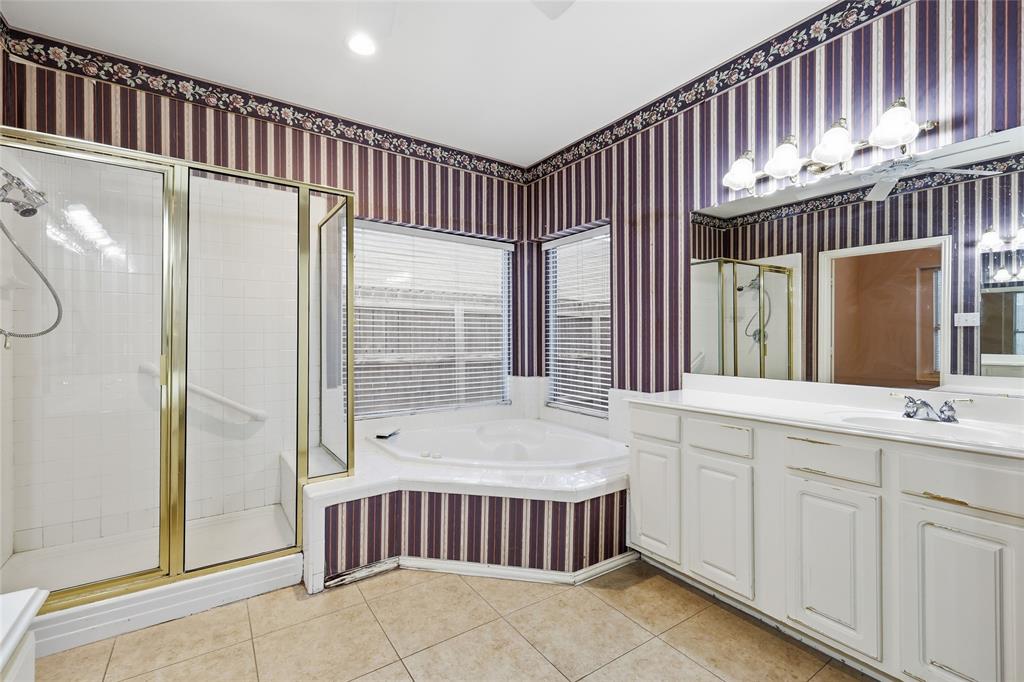 2216 Post Oak Court Corinth, TX 76210 - Photo 11 of 19 a bathroom with a bathtub and a sink